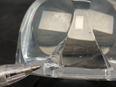 (2) Lucite Coin Paperweights (1 damaged) - 9