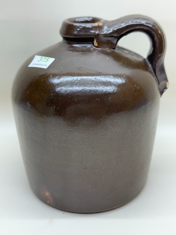 Brown Glazed Stoneware Jug with Surface Wear