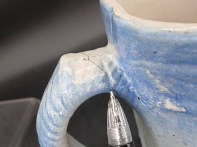 (2) Blue and White Stoneware Pitchers with Relief Designs - 10