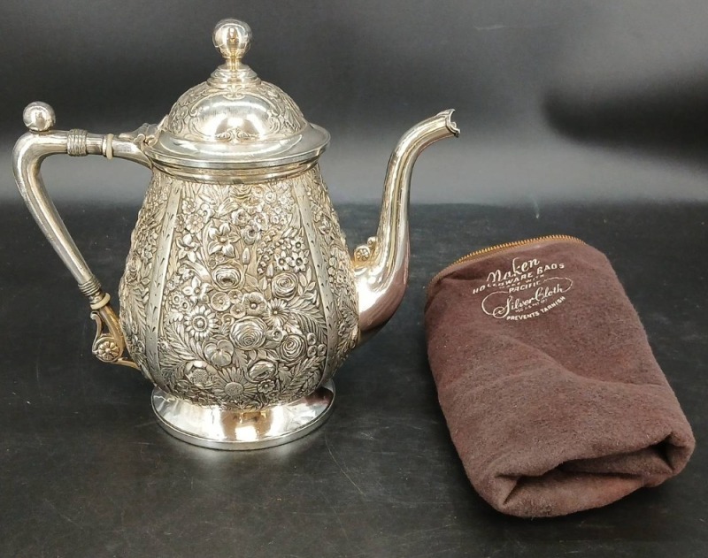 Ornate Silver Teapot with Floral Design