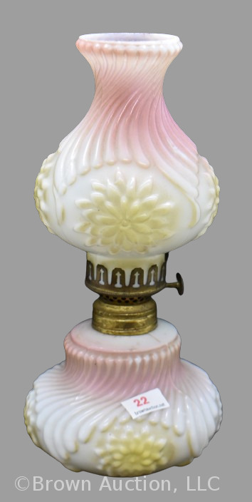 Opaque white 9" miniature oil lamp, tinted pink base and chimney-type shade, both with a spiral pattern in relief, medallions of yellow dahlias