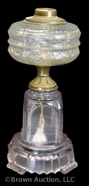 Kerosene lamp stand, base (turning purple) featuring miniature bride and groom figurines