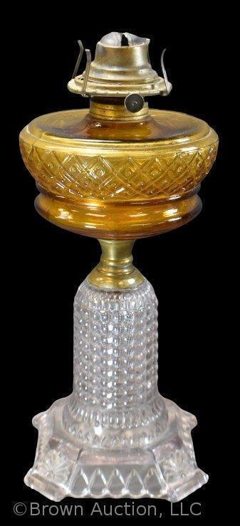 Kerosene lamp with clear Thousand Eye base and amber Beaded Lattice font, 12" tall