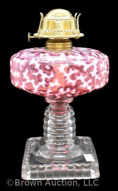 Cranberry opalescent Coral Reef oil lamp with clear ringed stem/ square base,