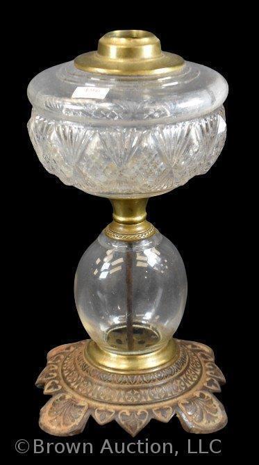 EAPG kerosene lamp on ornate metal base, 11" tall, clear glass base