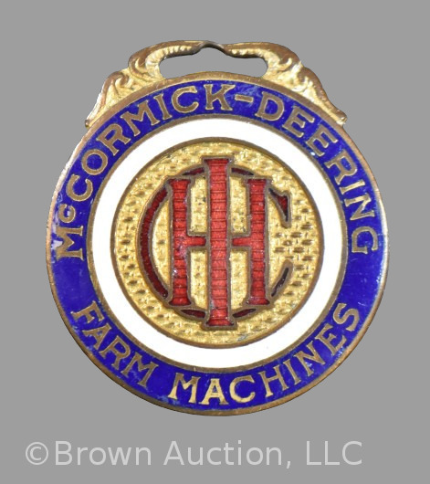 McCormick Deering Farm Machines advertising watch fob, 1.5"d