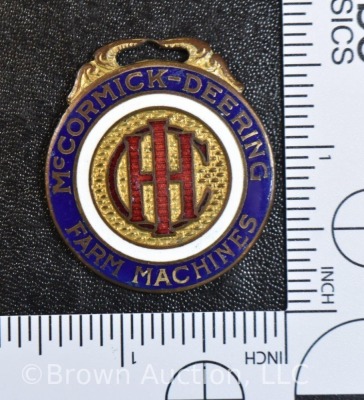 McCormick Deering Farm Machines advertising watch fob, 1.5"d - 5