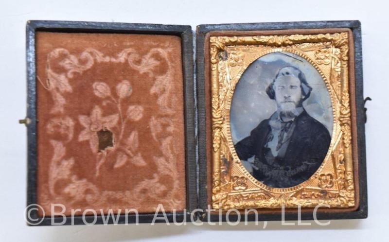 Daguerreotype photo in embossed case, image of man in suit