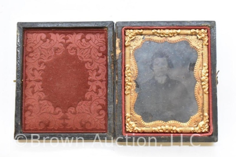 Daguerreotype photo in embossed case, image of man in suit