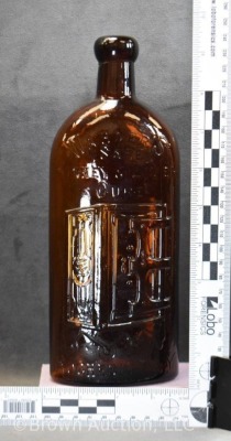 Warner's Safe Kidney and Liver Cure embossed bottle, 9.5" tall - 8