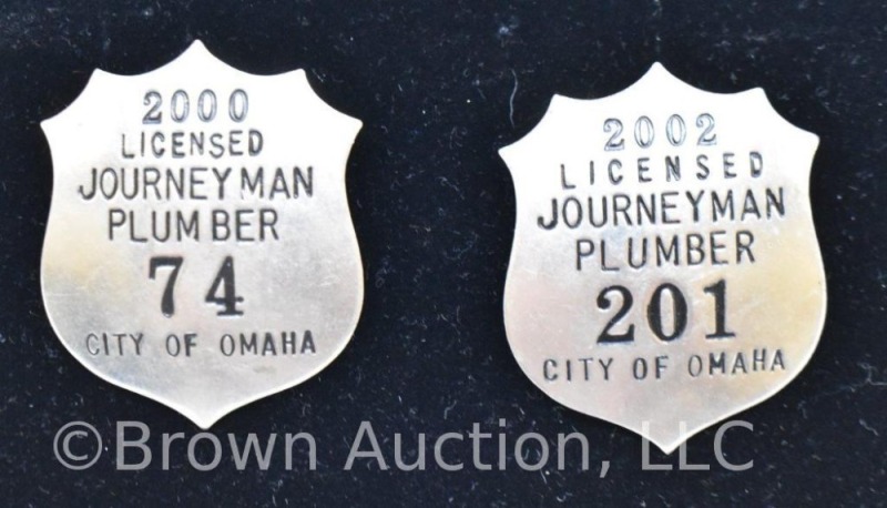 (2) City of Omaha Licensed Journeyman Plumber badges, 2000 and 2002