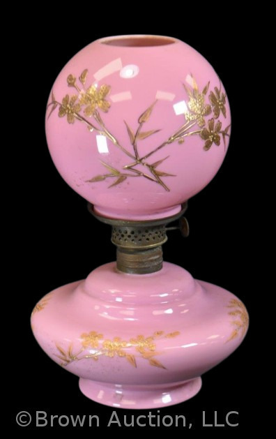 Pink cased glass miniature oil lamp with enameled gold flowers