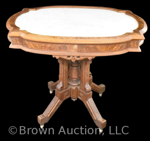 Ornate walnut marble top parlor table, nice incised motifs and carved lion's heads on apron