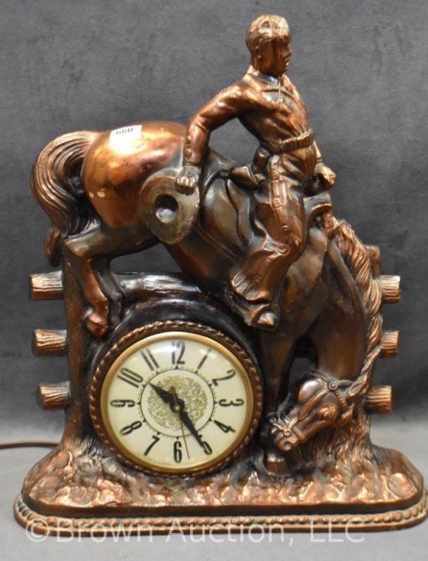 M.L. Gilbert copper/ bronze clock featuring bucking bronco and rider,