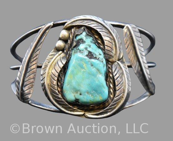 Navajo turquoise cuff bracelet, signed TM, feather designs accents