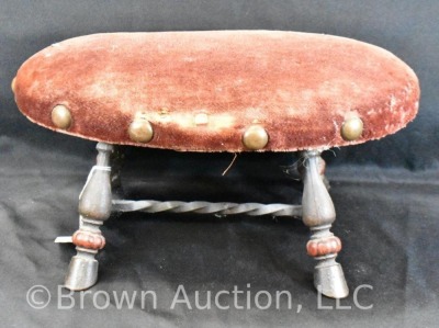 Upholstered foot stool with cast iron base