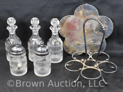 5 pc. castor set (bottles all match), holder sits atop a silverplate scalloped and ftd. plateau - 5