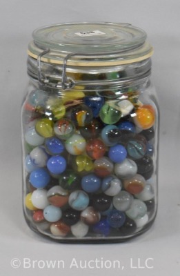 Large jar of mixed marbles