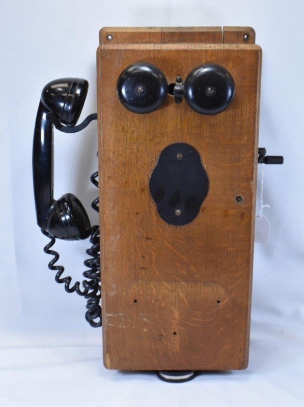 Old wooden wall crank telephone (missing lower shelf)