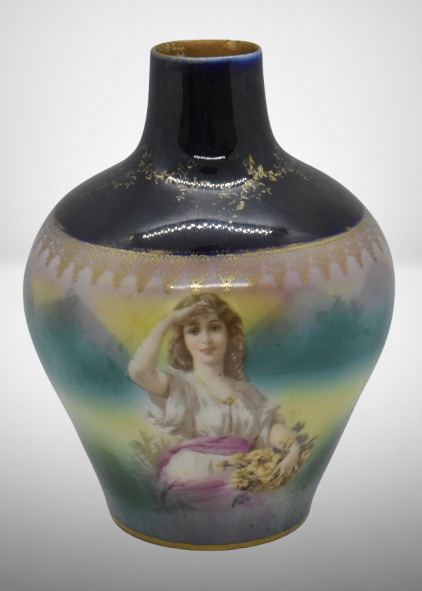 Royal Bayreuth 6"h vase w/ cobalt top, woman peering into distance, blue mark