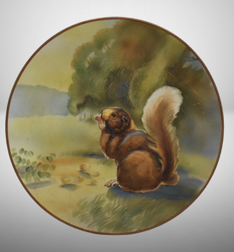 Mrkd. Nippon 10.5"d hanging plaque plate w/ blown-out squirrel