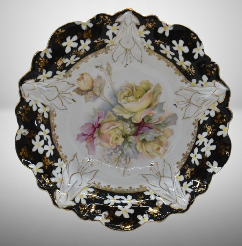 Unm. porcelain 10.25"d bowl, soft yellow roses/ black border w/ scattered white flowers, circle mold mark