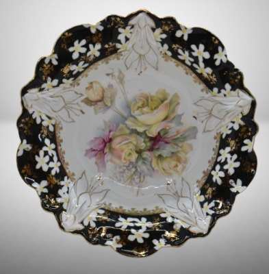 Unm. porcelain 10.25"d bowl, soft yellow roses/ black border w/ scattered white flowers, circle mold mark