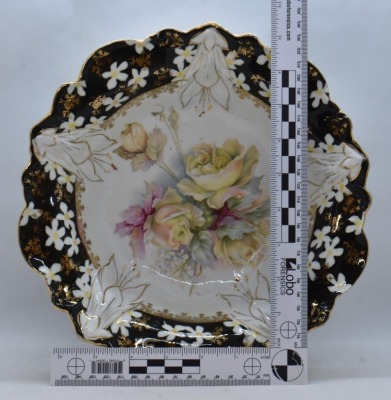 Unm. porcelain 10.25"d bowl, soft yellow roses/ black border w/ scattered white flowers, circle mold mark - 6