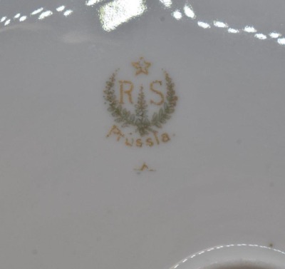 (2) R.S. Prussia Mold 82 11"d cake plates, both have nice floral designs, circle mold marks + 1 w/ red mark - 5