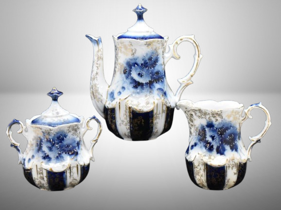 Handpainted porcelain 3 pc. cobalt dematisse tea set, lots of gold highlights