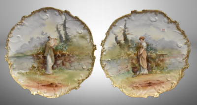 (2) Handpainted porcelain 13.5"d plaques featuring peasant girls scenes