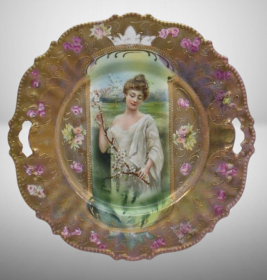 R.S. Prussia Mold 343 9.5"d cake plate, Spring season portrait in keyhole medallion, irid. Tiffany finish, red mark