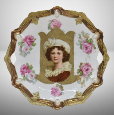 R.S. Prussia Ribbon and Jewel 10.5"d cake plate featuring LeBrun II portrait on gold stippled background, red mark