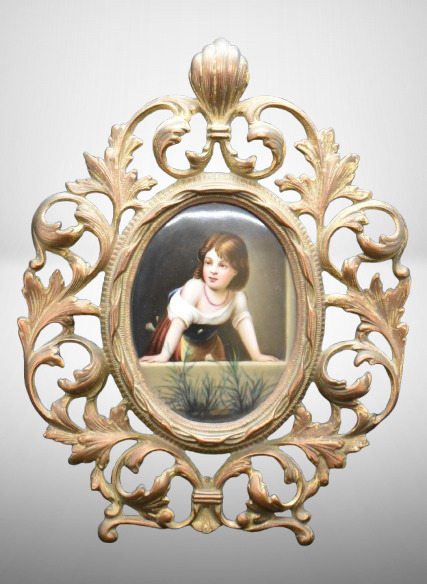 Small Framed KPM plaque, child peerng over, ornate brass framework