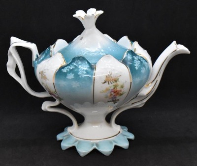 Unm. 3 pc. tea set in Steeple Mold 12, alternating panels of flower clusters and blue finish w/ shadow flowers - 3