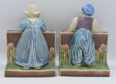 Pair of mrkd. Rookwood Art Pottery bookends, #6022 dutch boy and girl, dated XXIX - 4