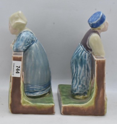 Pair of mrkd. Rookwood Art Pottery bookends, #6022 dutch boy and girl, dated XXIX - 5