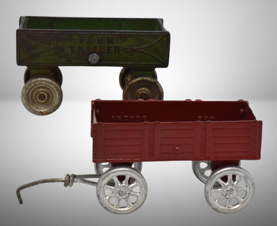 (2) Cast Iron farm trailers: Kenton Toys and Arcade