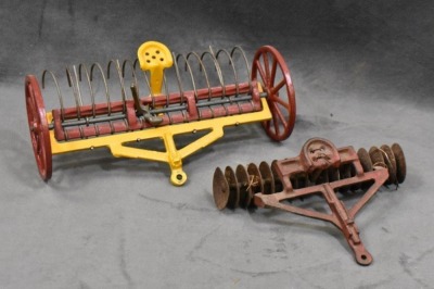 (4) Cast Iron toy implements: 2-botttom plow (Arcade), corn sheller (Arcade), disc (Arcade) & hay rake (Kenton?, larger) - 2