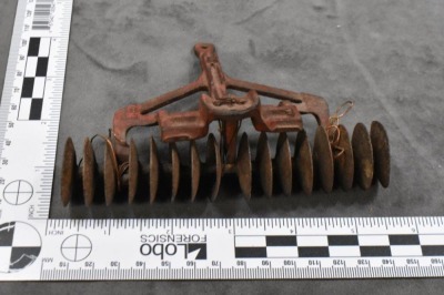 (4) Cast Iron toy implements: 2-botttom plow (Arcade), corn sheller (Arcade), disc (Arcade) & hay rake (Kenton?, larger) - 5