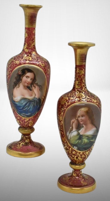 Pair of Bohemian Moser cranberry 8"h portrait vases, gilt decoration