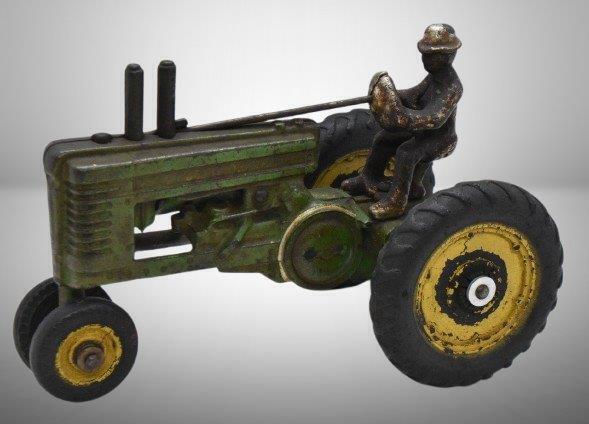 Arcade cast iron John Deere model A tractor, rubber tires, 7"l