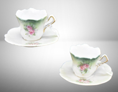 (2) Miniature handpainted porcelain cup and saucer sets, pink roses