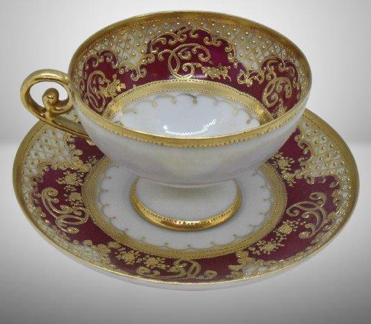 Mrkd. Nippon cup and saucer set, maroon w/ heavy gold enameled highlights