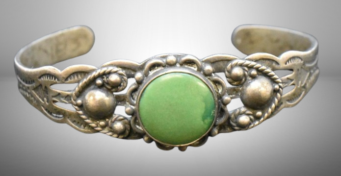 Mrkd. Sterling cuff bracelet w/ green stone