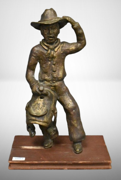 Bronze Cowboy sculpture by artist Schultz on wooden base