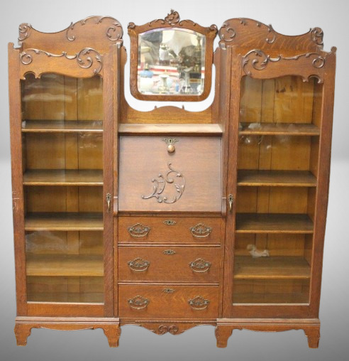 Oak drop slant-front secretary desk/ dbl. bookcases, 3 drawers below, beveled mirror
