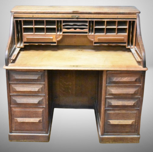 Antique S-roll top desk, drawers and pull-out trays on each side, lots of cubby holes