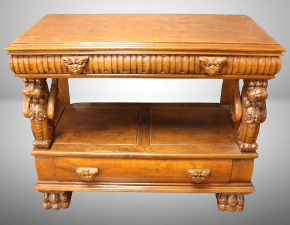 Antique heavily carved server, gargoyle faces and figures, lower storage drawer, paw feet