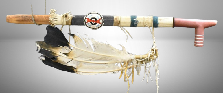 Native American Indian ceremonial pipe decorated w/ feathers and beading